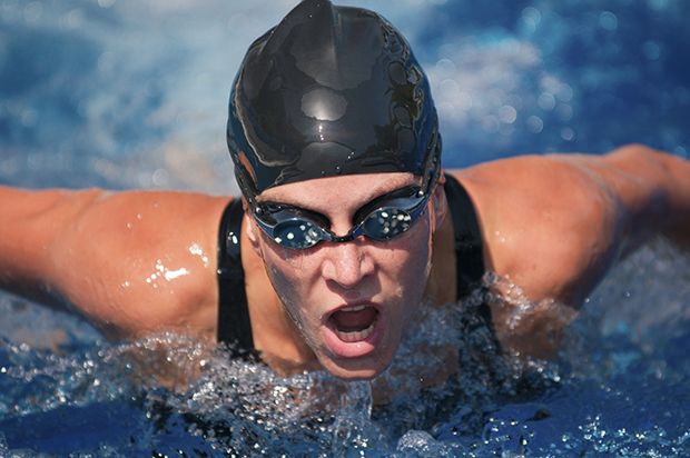 Female butterfly swimmer in action